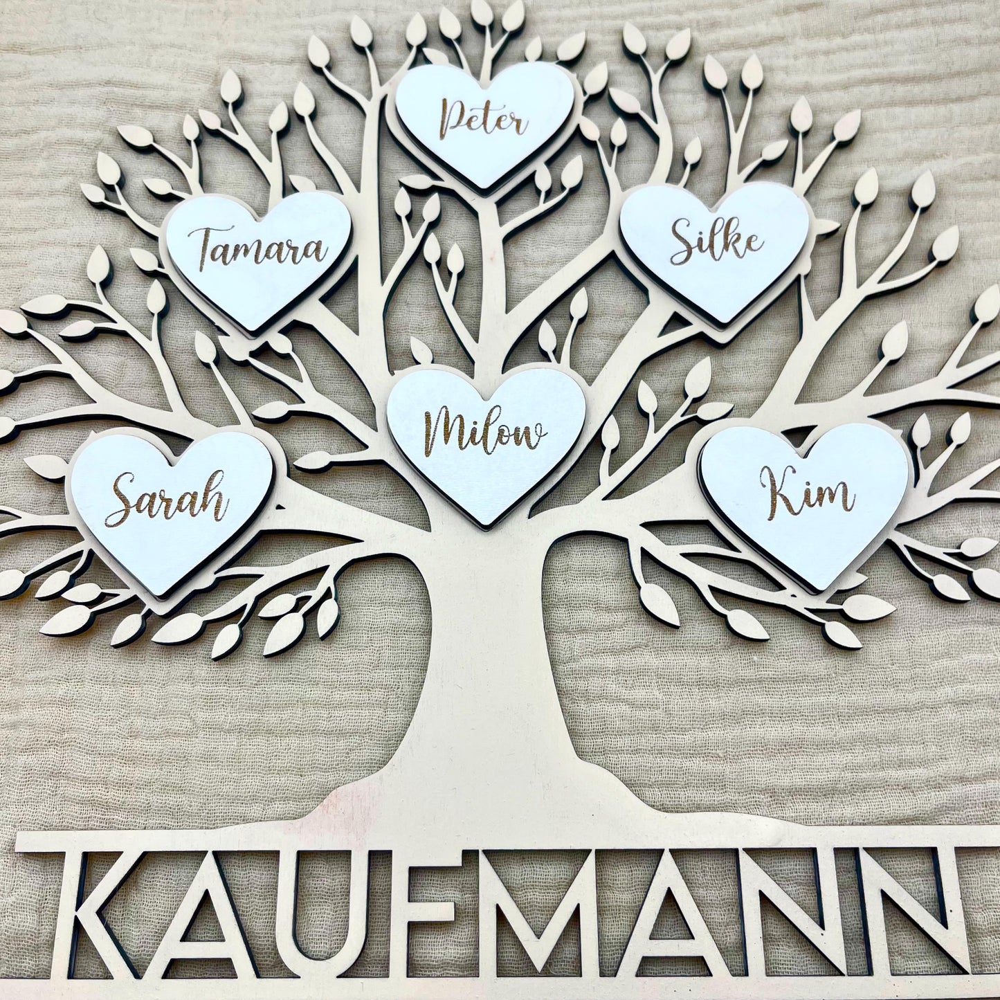 Wooden family tree with family name & hearts