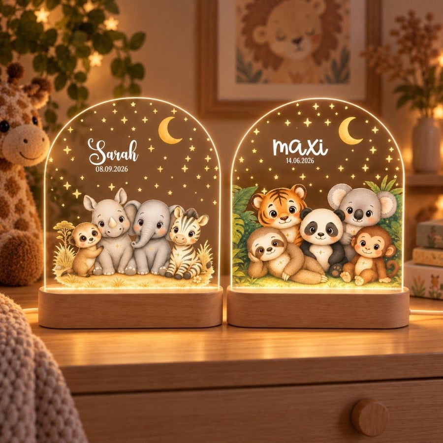 Two safari night lights with Sarah and maxi, glowing in front of giraffe on a chest of drawers